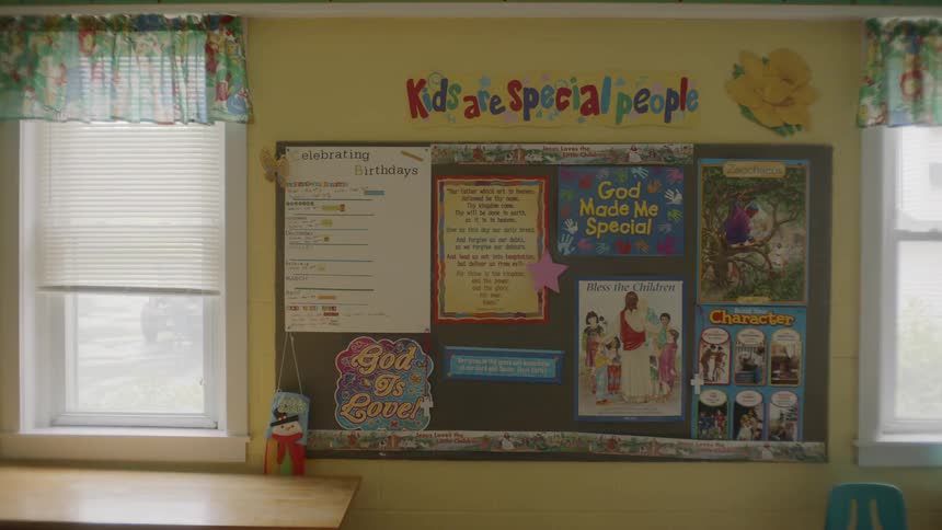 A board in a classroom with notices on it