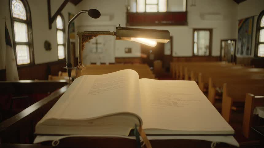 The book sits open in the church