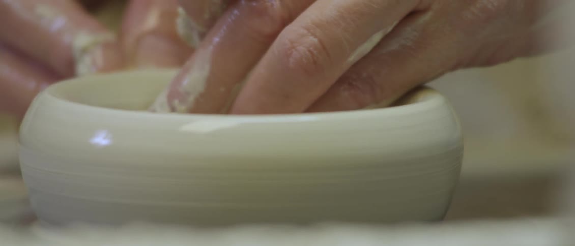 A person making pottery