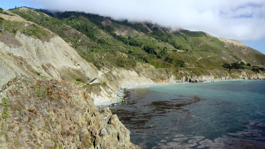 Aerial scene of shoreline view near cliffside