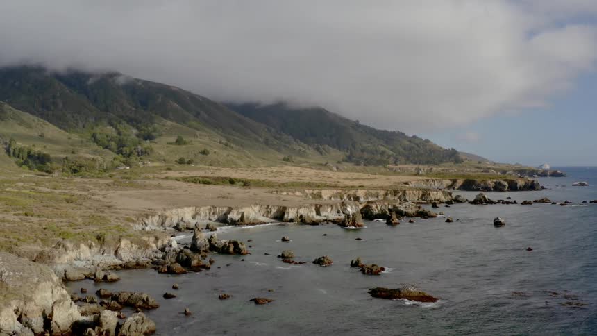 Waves crash against a rocky coastline