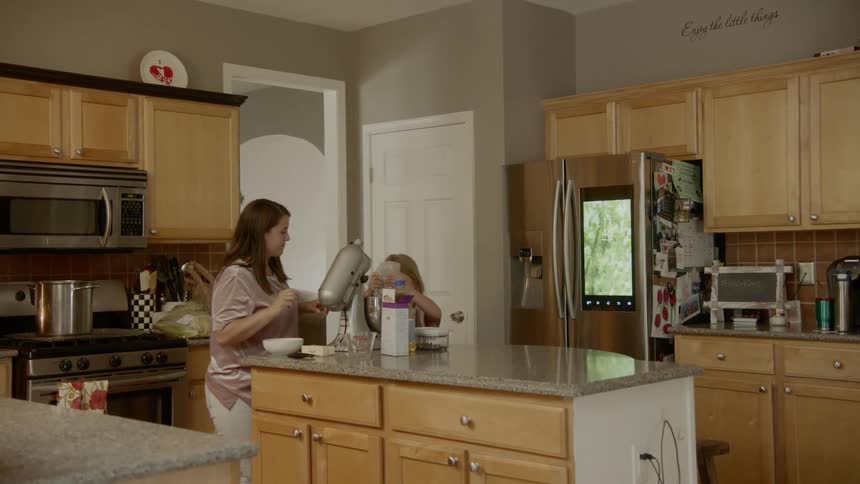 Mom and daughter bake in the kitchen