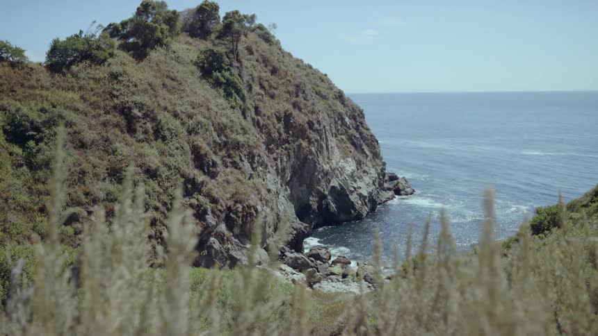 Landscape view of water meeting a cliff