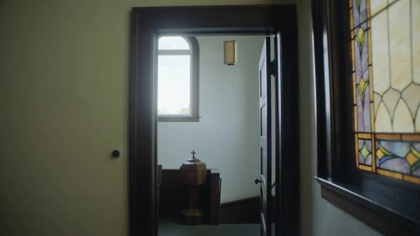 View interior of church door and glass mosaic window