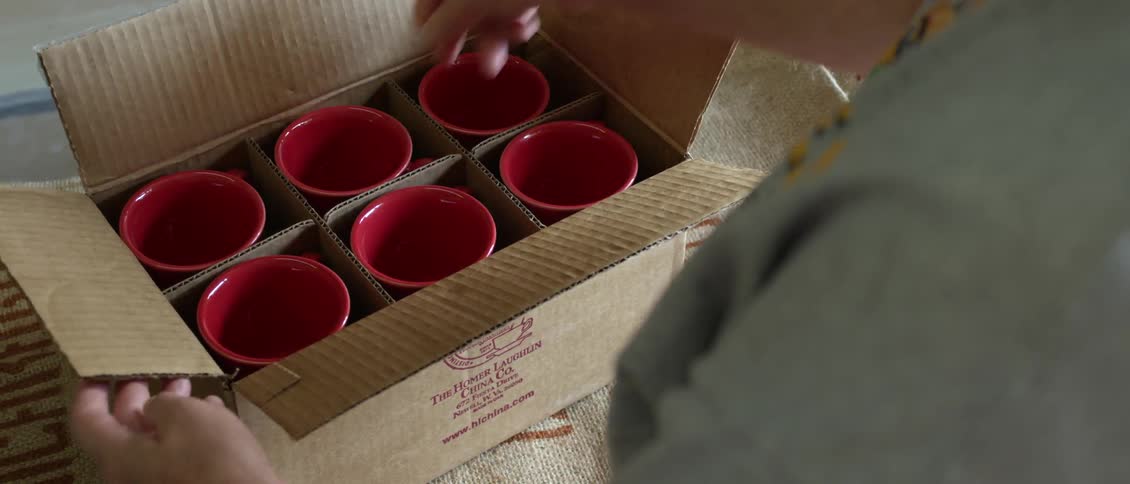 A person packing things in a box