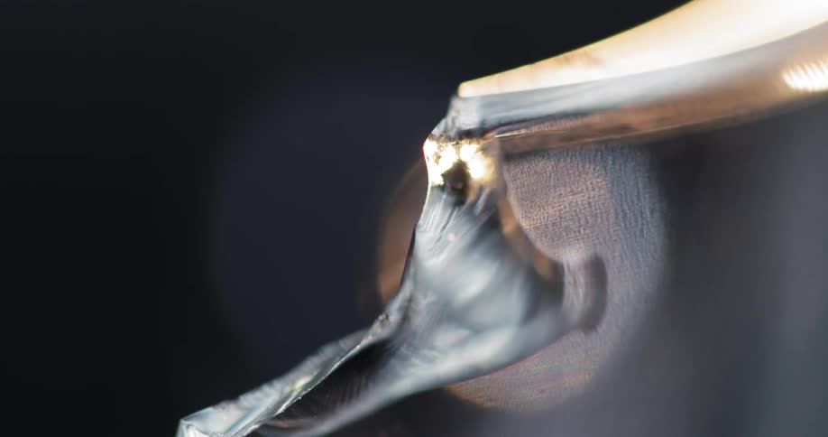 Light shines on a close up of broken glass