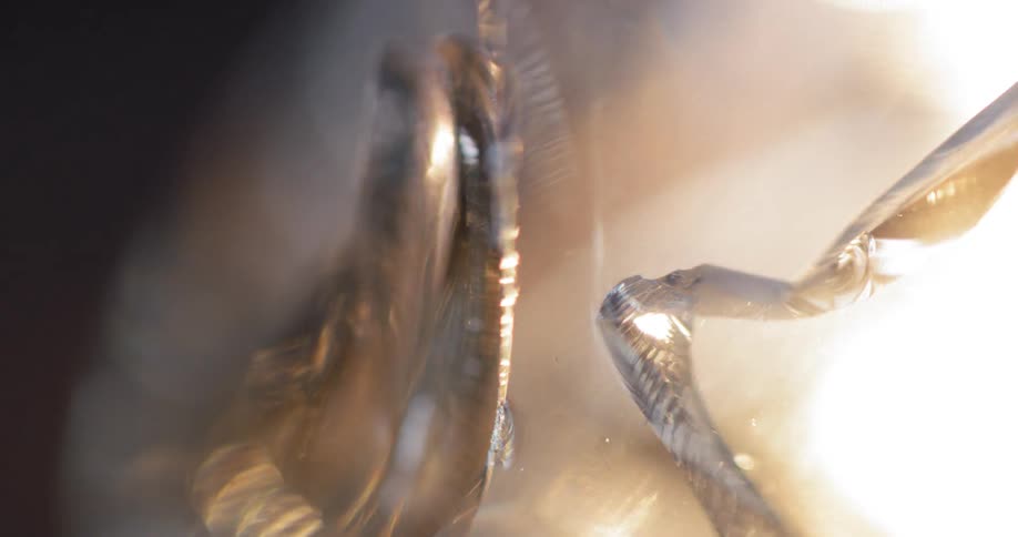 A crack glass with light shining off of it