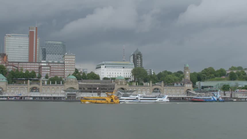 River taxi and boats outside of a large city