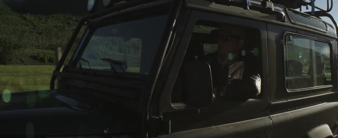 A person driving a jeep