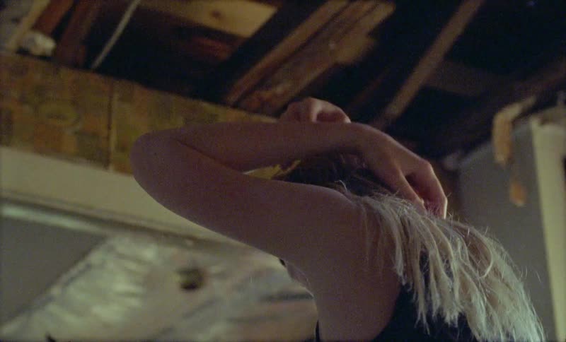A woman listens to music and dances