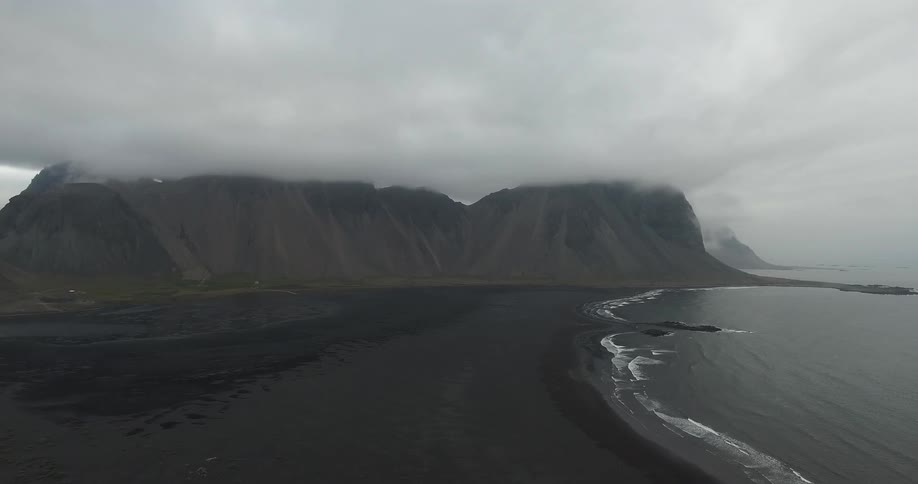 Clouds are cover some mountains by the water