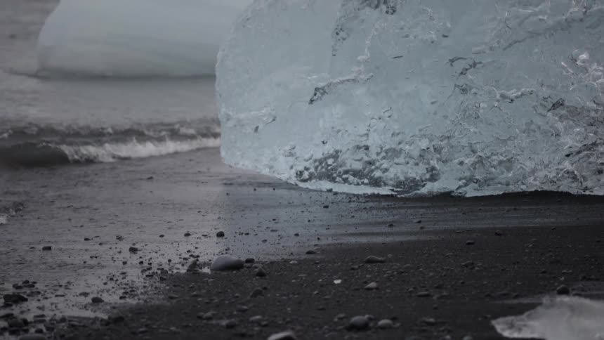 Waves rolling in around chunks of ice