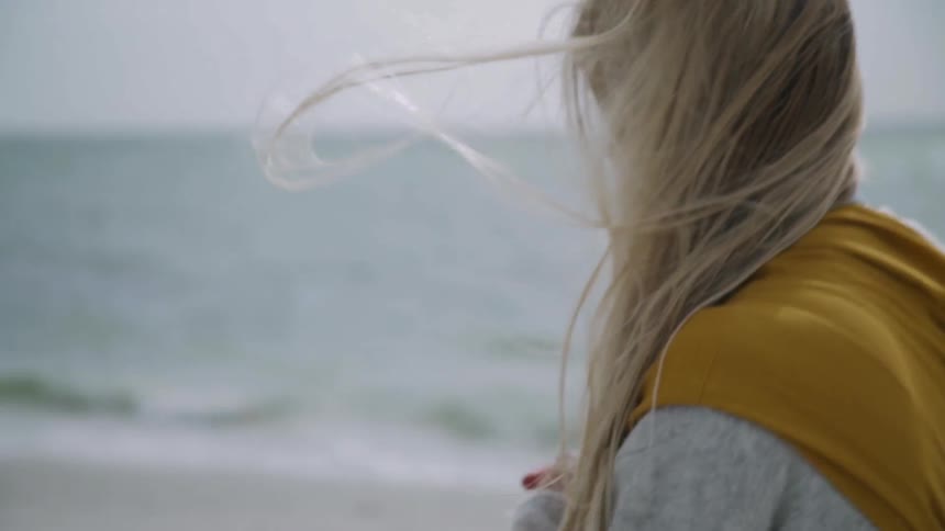 A woman walking on the beach