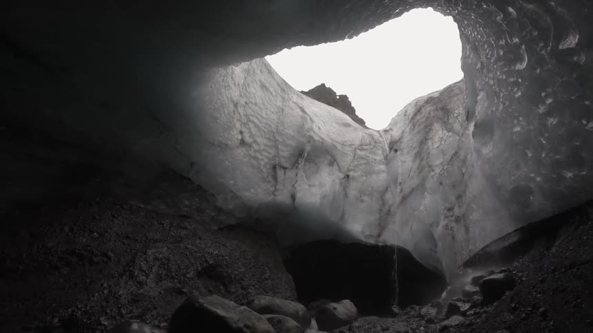 A gap to the outside can be seen from within a cave