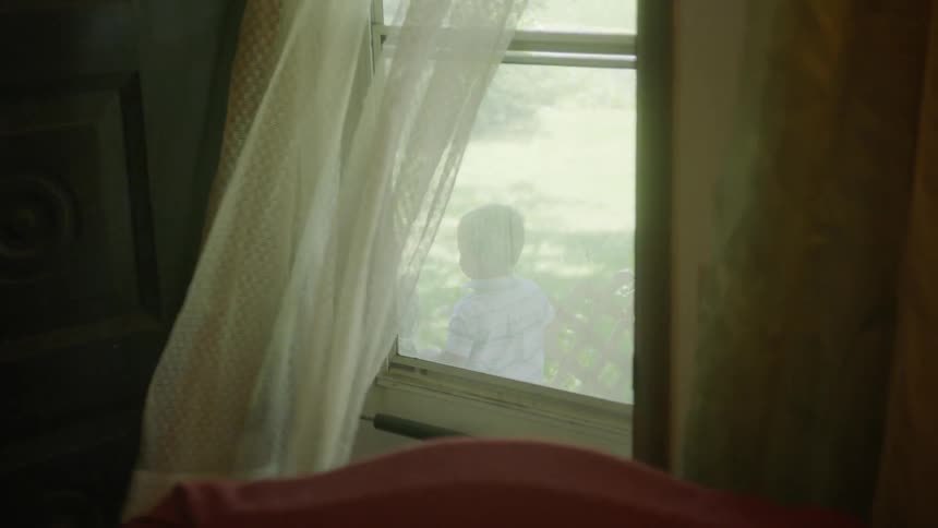 Children are playing outside curtained door