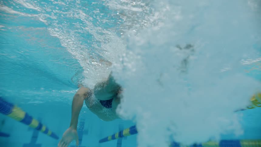 A man swims in the pool