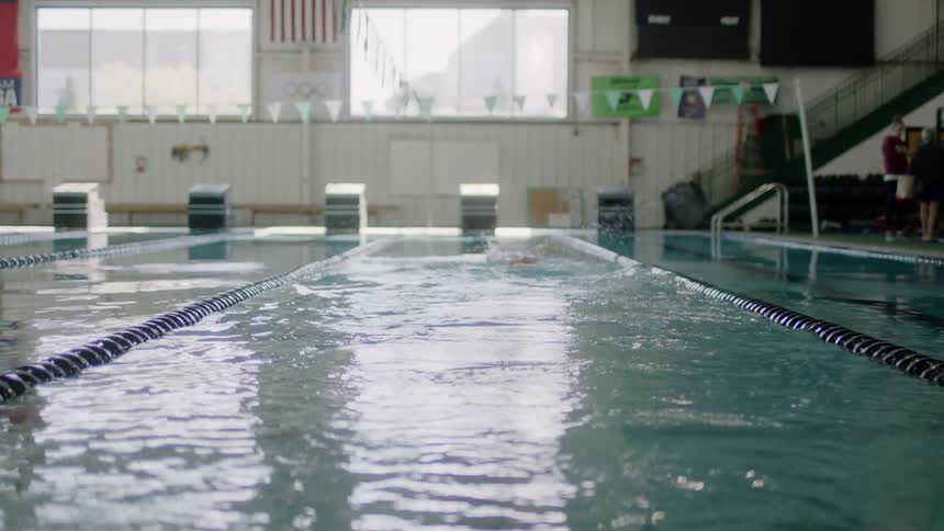 A person swimming in a swimming pool