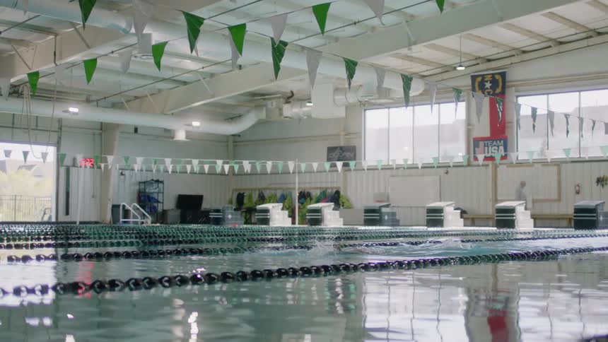 A person is swimming in the pool