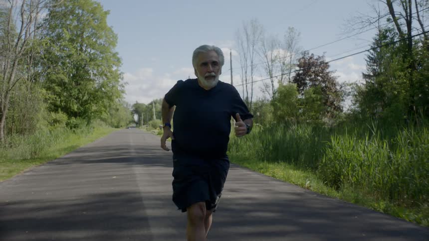 A man is jogging outdoors