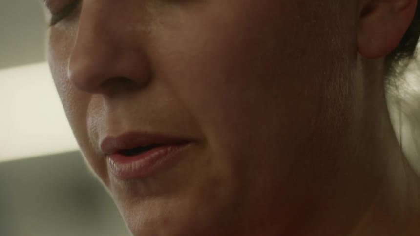Woman closes her eyes and breathes out