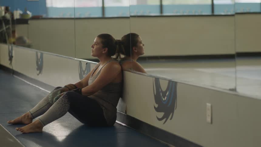 A ballerina contemplating at the sudio