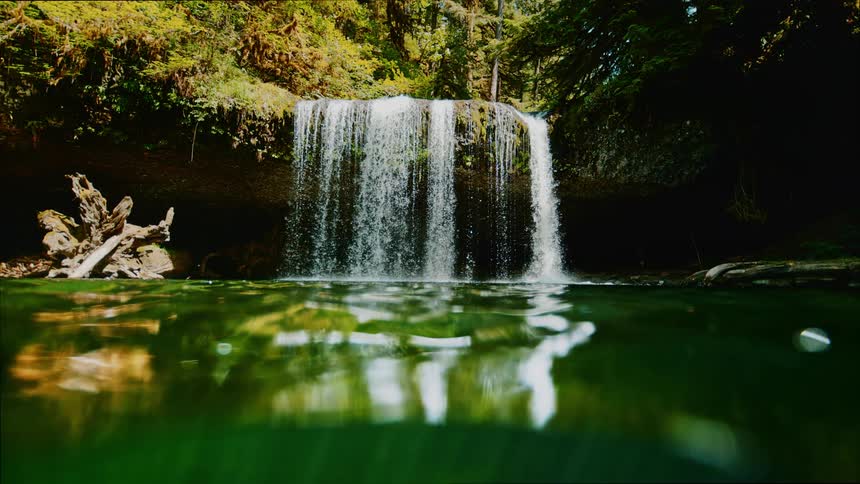 A water falls splashed over the hill and in to the lake below
