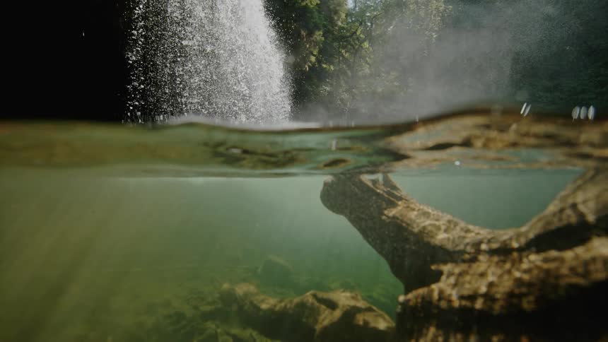 Water falls into the lake below