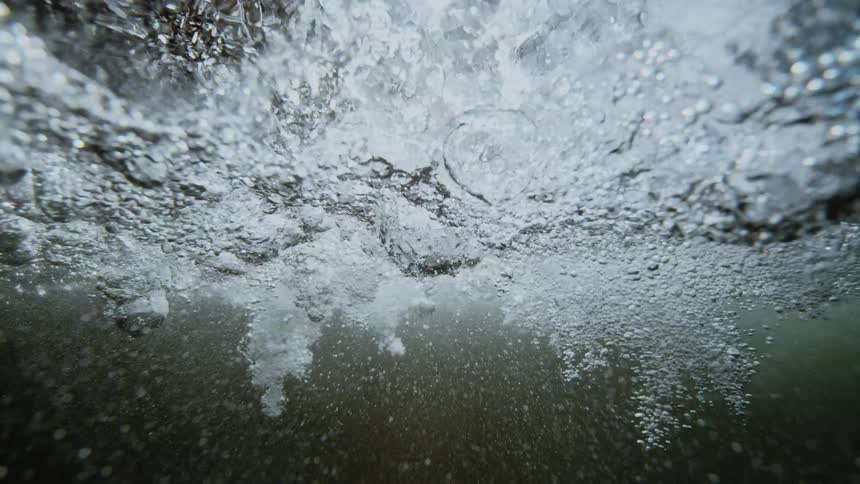 Water shimmering with bubbles and light