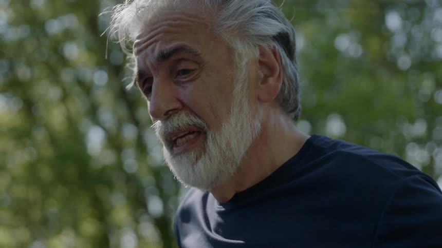 A man is breathing heavily in the forest