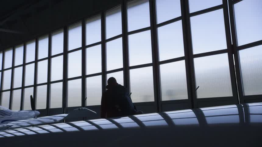 A silhouette of a man walking