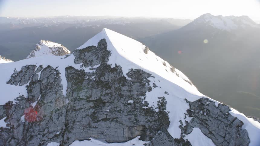 An aerial view of mountains are displayed