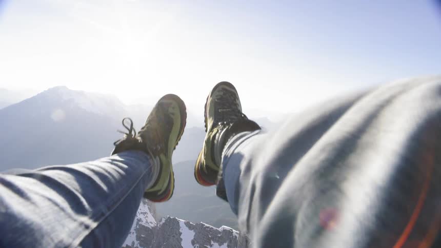 Man legs hanging from the helicopter