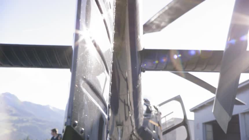 A man walks out of a helicopter