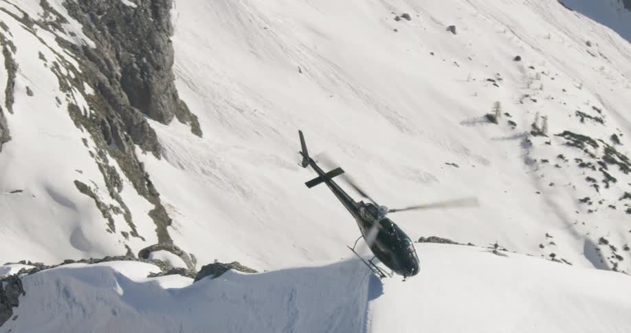 A helicopter on the peak of a mountain