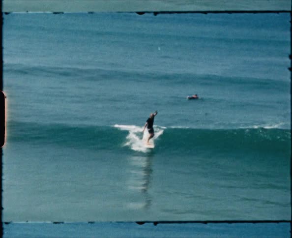 Film footage of a man surf boarding