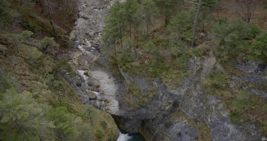 An aerial view of a cliff and blue river