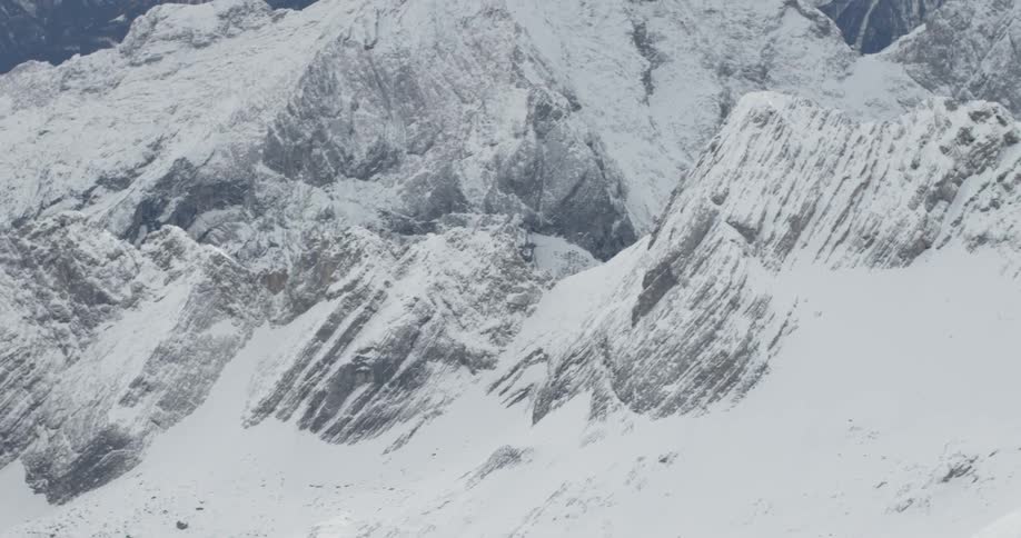 The mountains are vast and covered with snow
