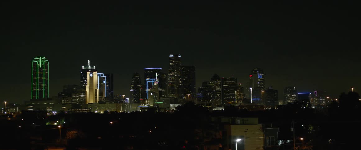 The skyscrapers in the skyline of a metropolis at night