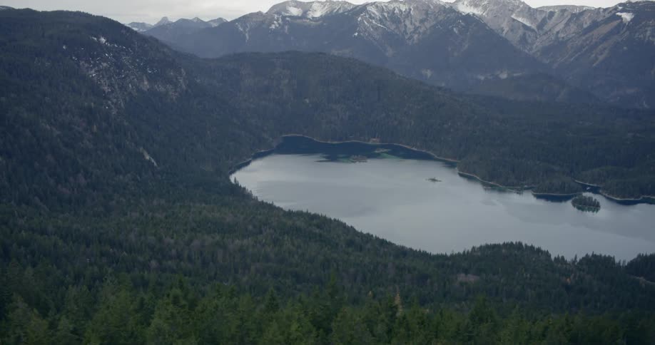 Tall mountains reflect off a lake