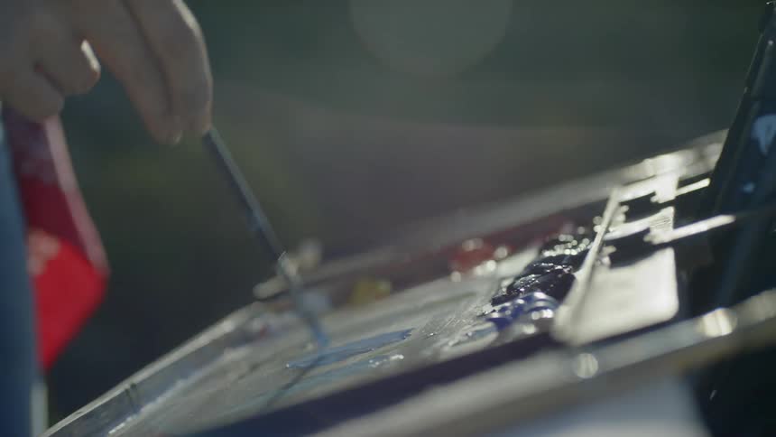 A person is painting indoors