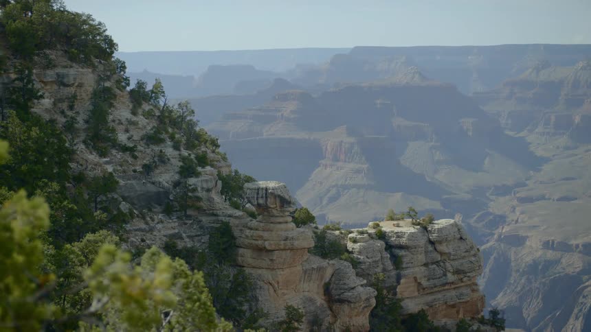 A scenery of a green cliff