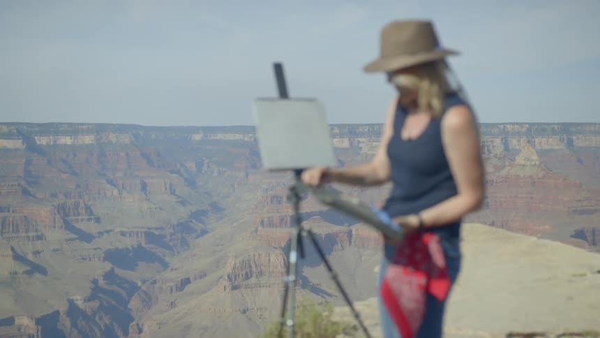 A portrait of a painter in the mountain