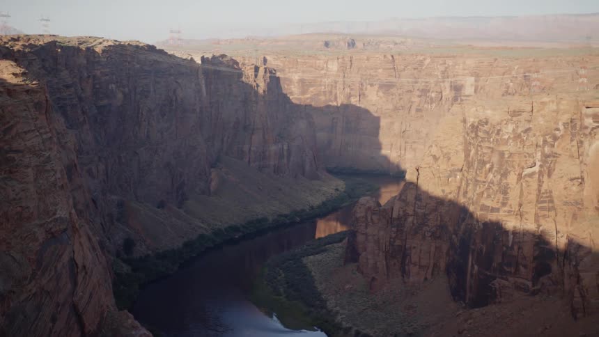 An aerial view of mountains and cliffs are displayed