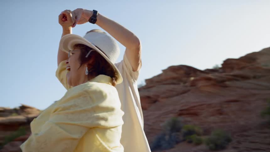 An old couple dancing in the canyon