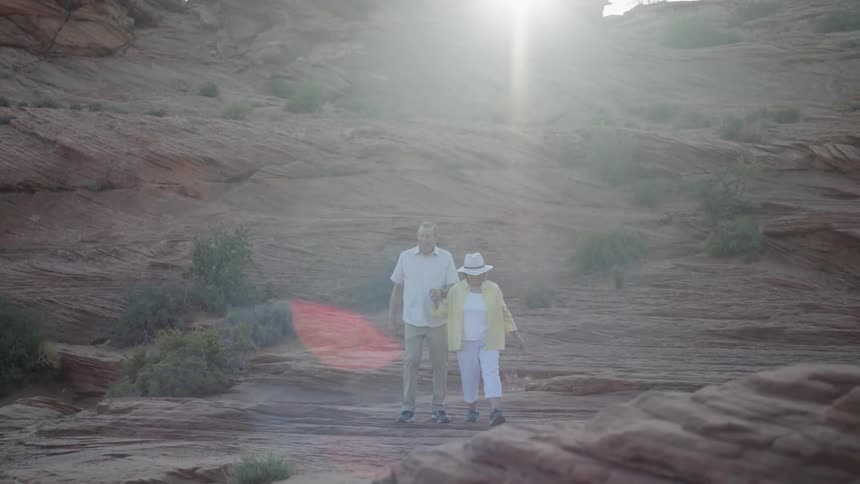 Husband and wife are hiking outdoors