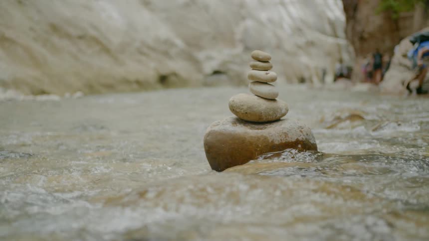 A rock in the middle of a river