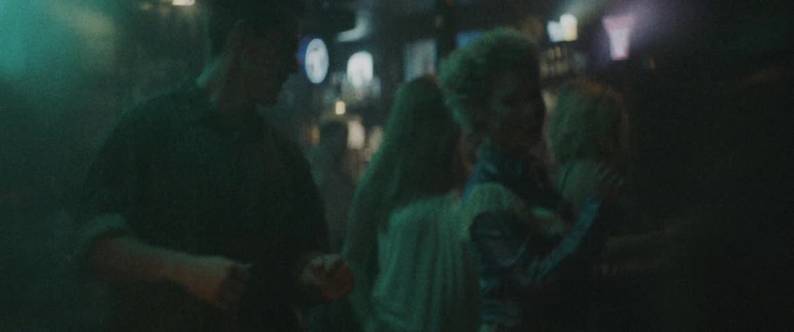 People are dancing in the bar together