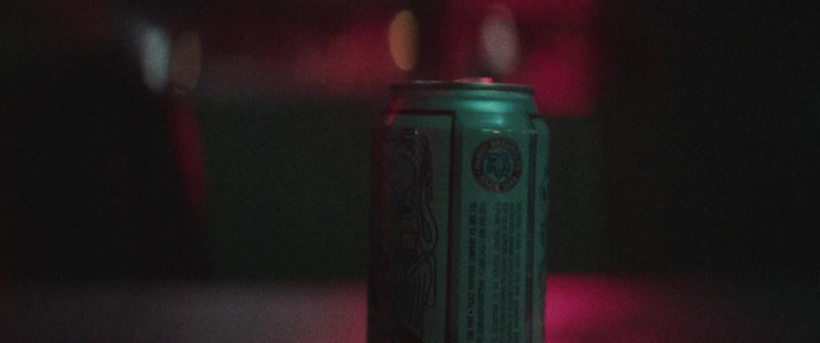 A beer can on a table in a bar or pub