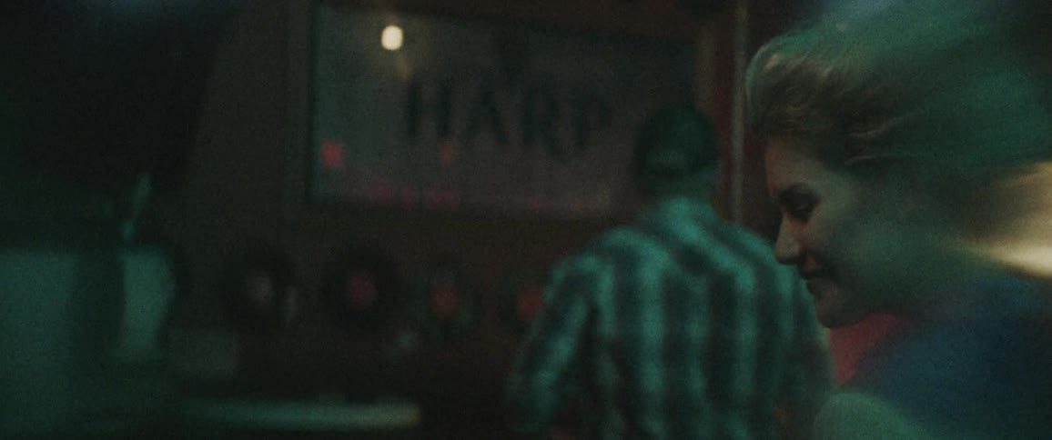A portrait of a woman in a bar