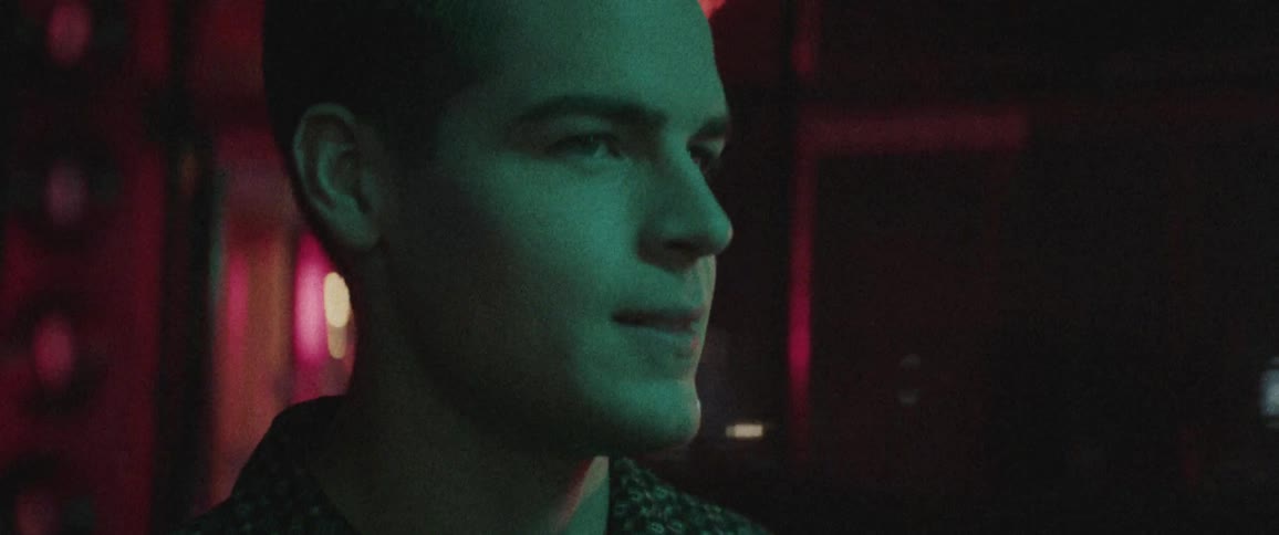 A portrait of a man in a bar